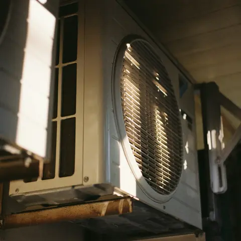 Outdoor air conditioning unit in warm afternoon light