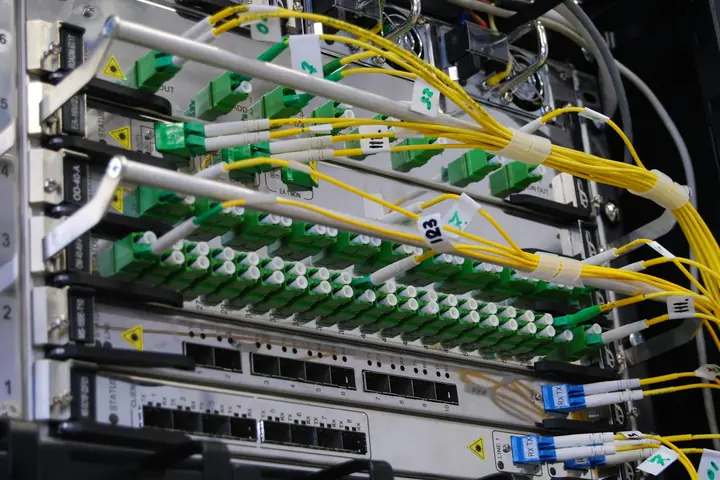 Fibre patch panel and network switching in a communications rack